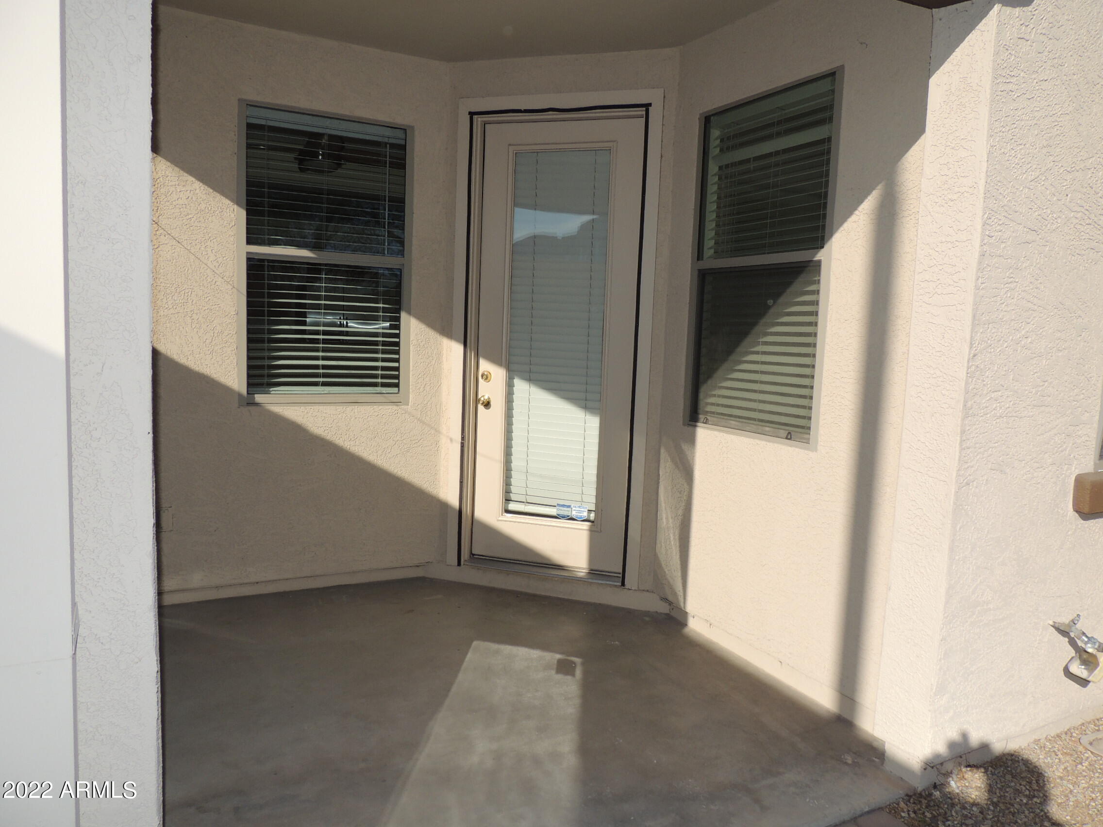 1886 East Don Carlos, Unit 165 Tempe, AZ 85281 - Photo 13 of 34 a view of a hallway with wooden walls and entryway