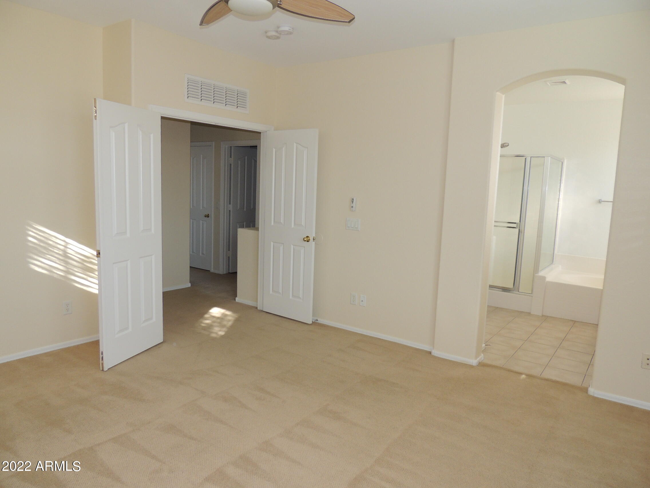 1886 East Don Carlos, Unit 165 Tempe, AZ 85281 - Photo 16 of 34 a view of an empty room and chandelier fan