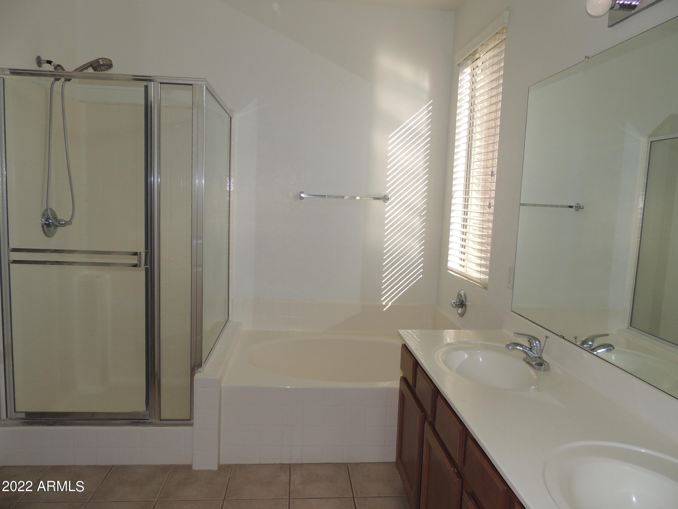 1886 East Don Carlos, Unit 165 Tempe, AZ 85281 - Photo 17 of 34 a bathroom with a tub sink shower and mirror