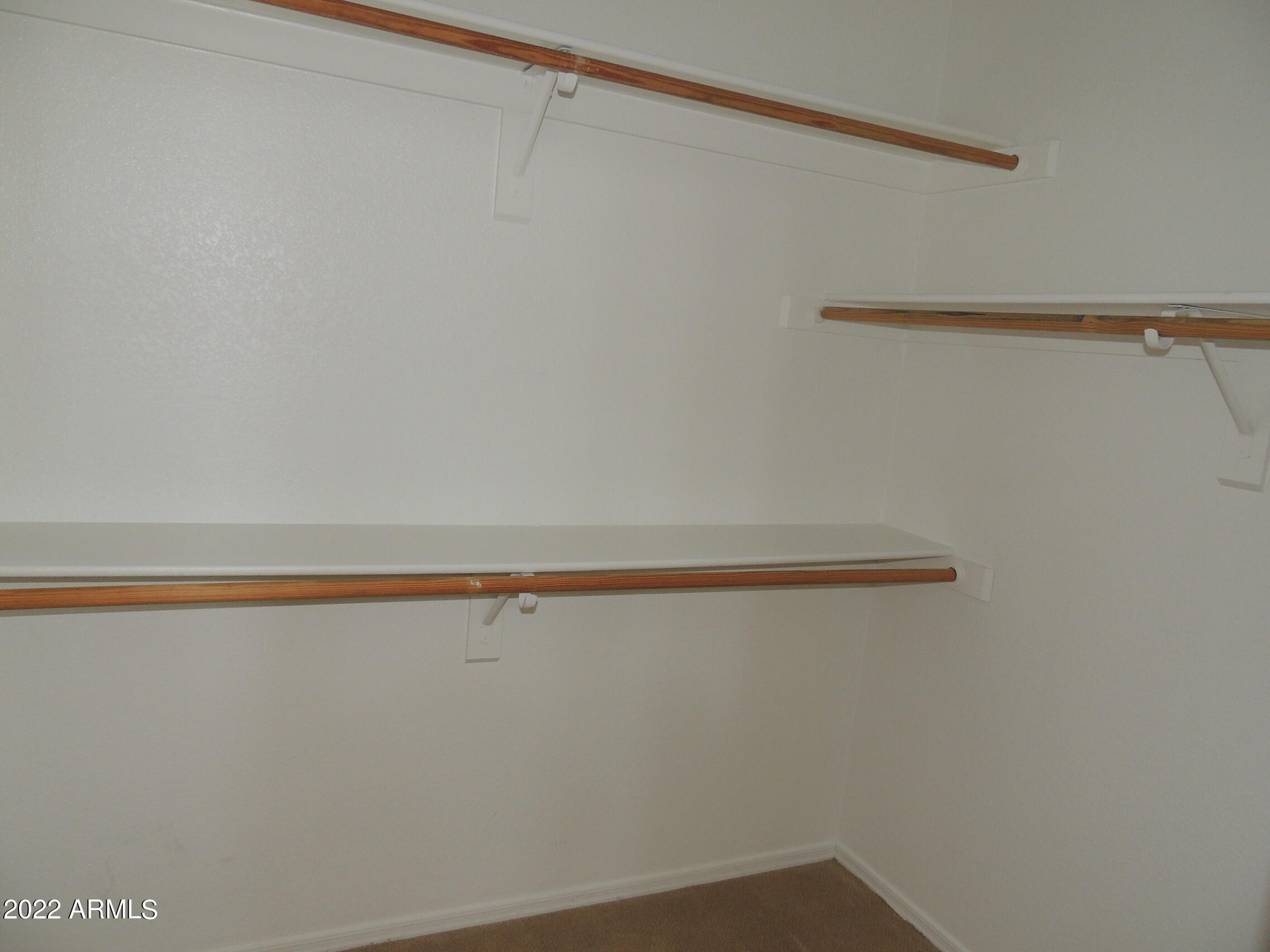 1886 East Don Carlos, Unit 165 Tempe, AZ 85281 - Photo 18 of 34 a view of a room with racks on the wall