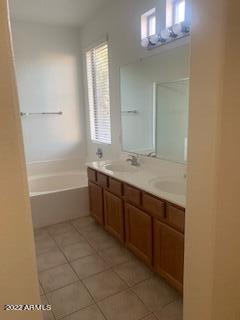 1886 East Don Carlos, Unit 165 Tempe, AZ 85281 - Photo 28 of 34 a bathroom with a tub sink vanity and a mirror