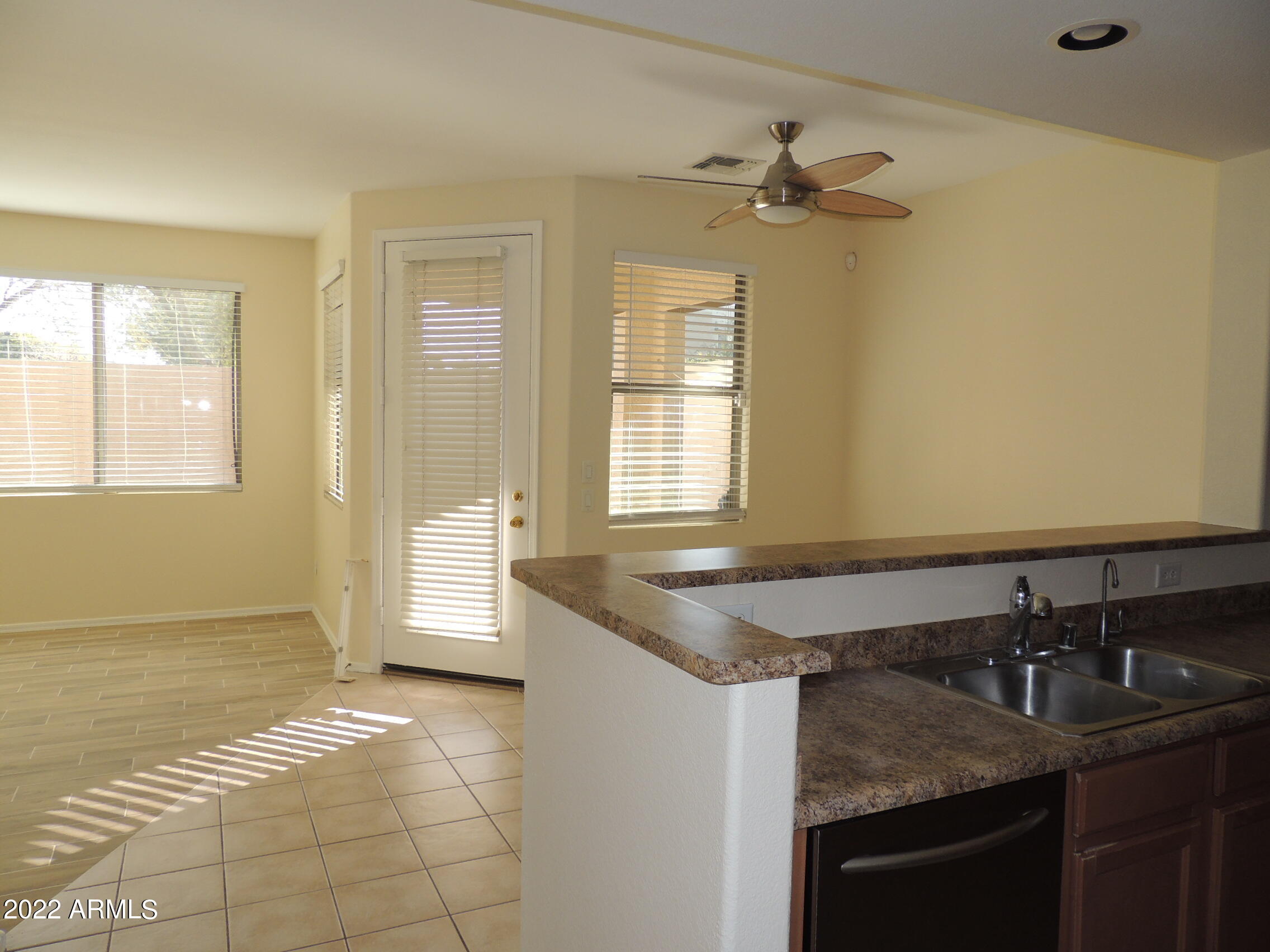 1886 East Don Carlos, Unit 165 Tempe, AZ 85281 - Photo 3 of 34 a bathroom with a granite countertop sink and a mirror