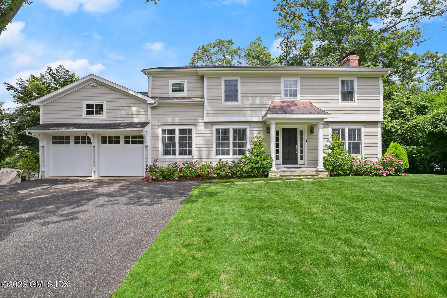front view of a house next to a yard