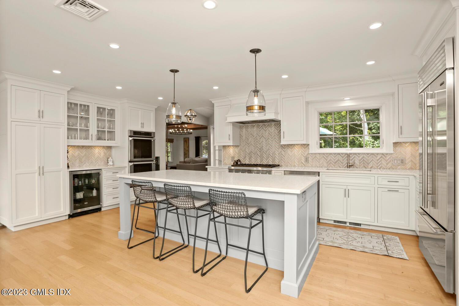 18 Candlelight Place Greenwich, CT 06830 - Photo 12 of 29 a kitchen with kitchen island granite countertop wooden cabinets and white appliances