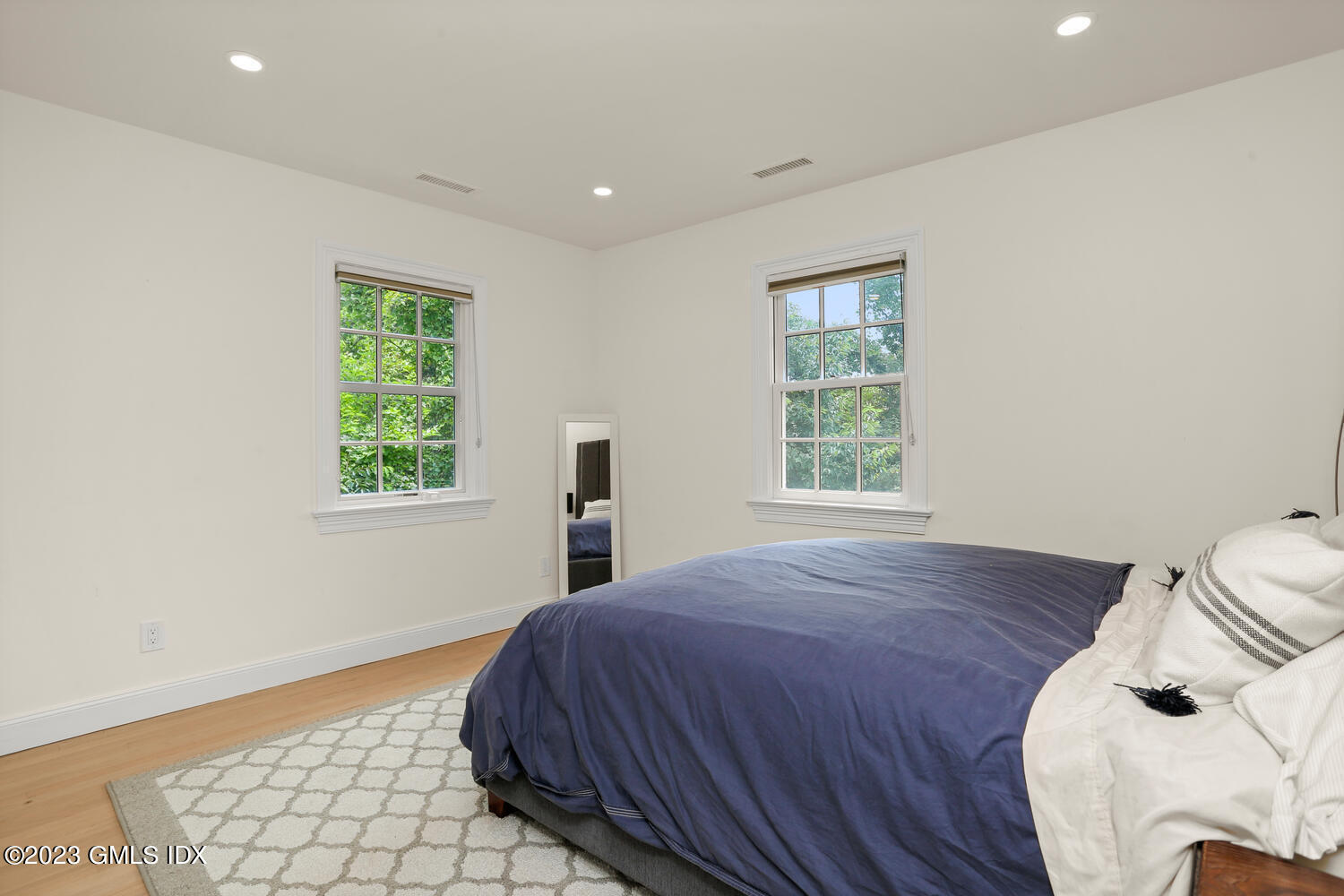 18 Candlelight Place Greenwich, CT 06830 - Photo 14 of 29 a bedroom with a bed and a window