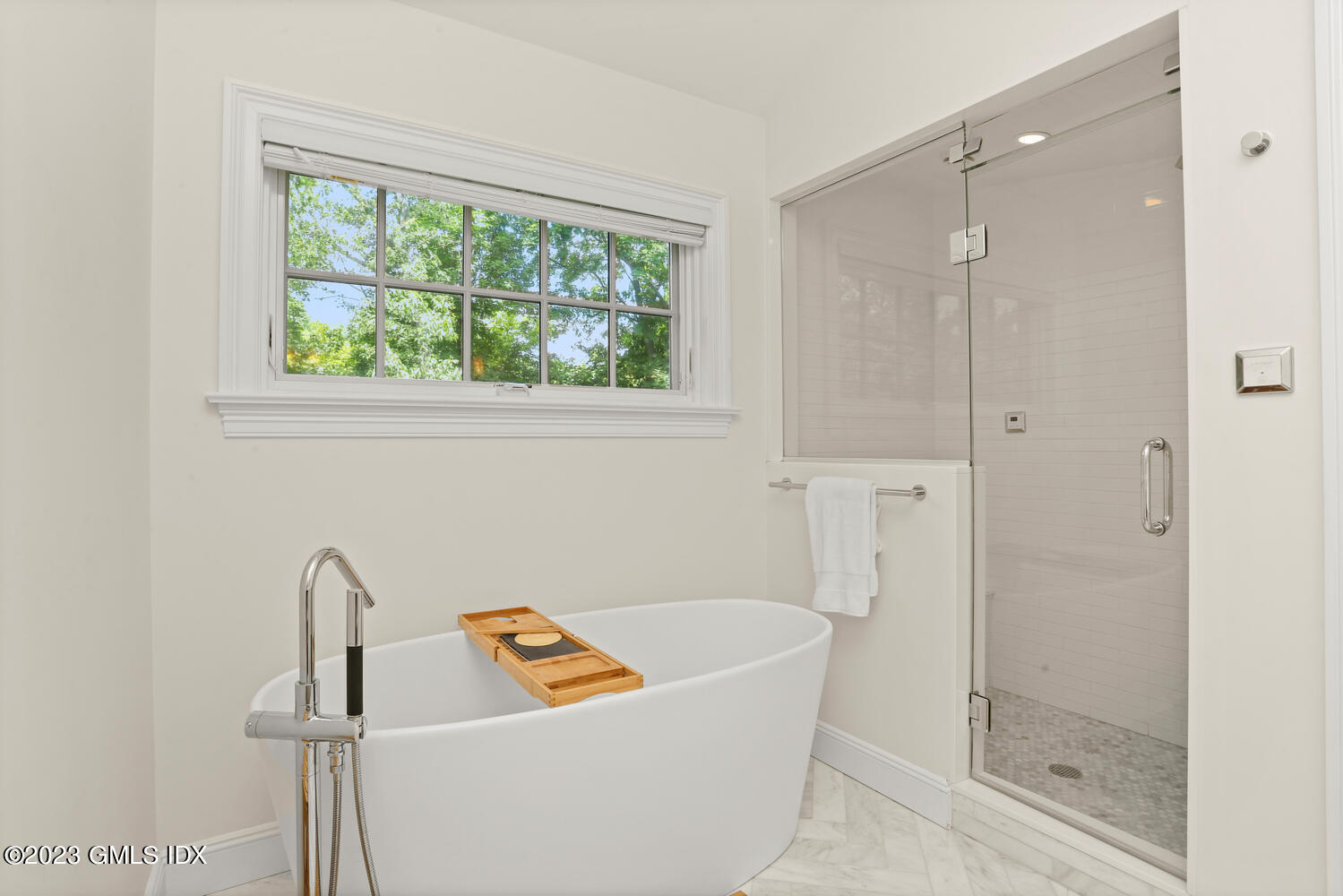 18 Candlelight Place Greenwich, CT 06830 - Photo 18 of 29 a bathroom with a tub and a shower