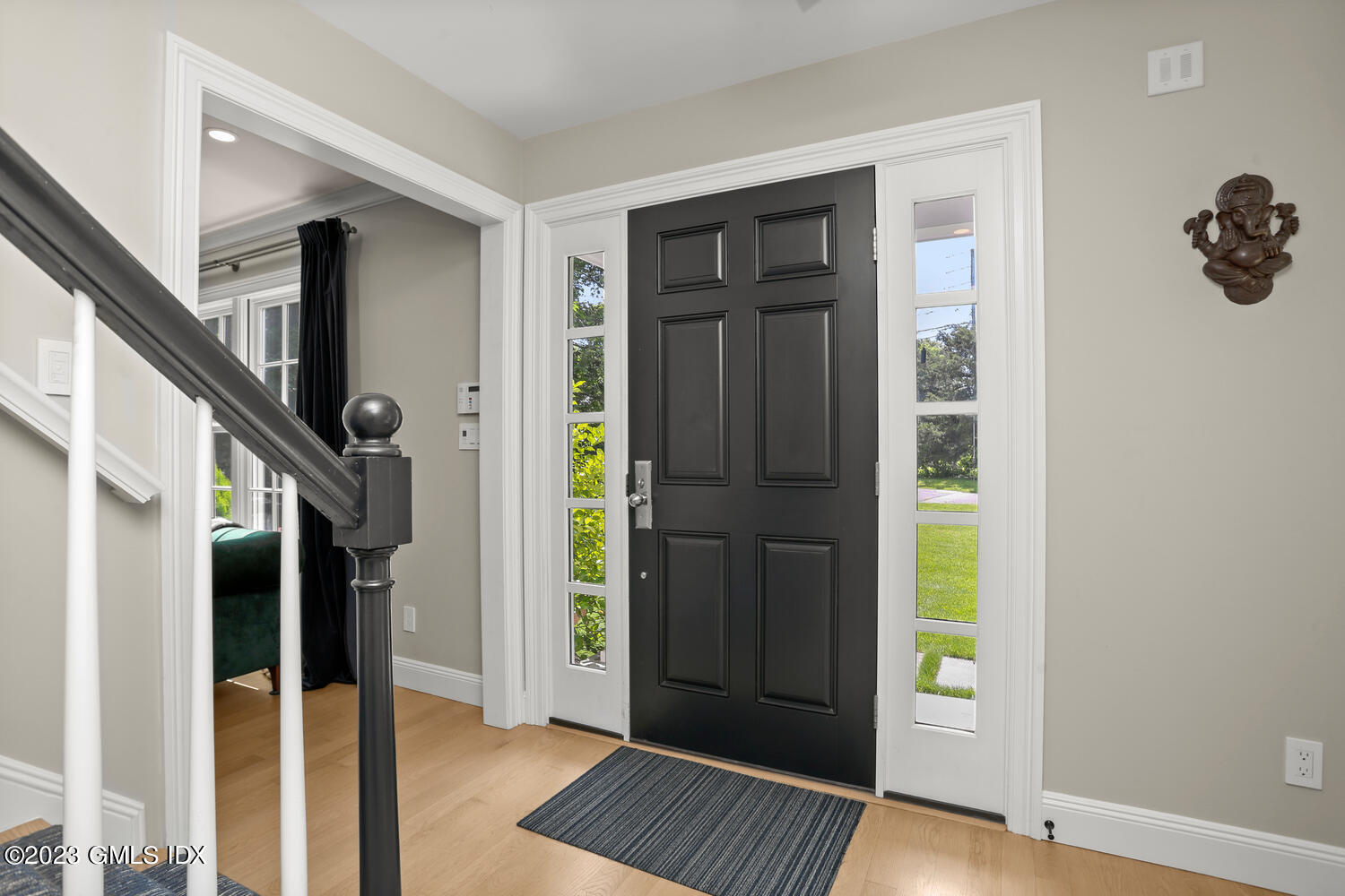 18 Candlelight Place Greenwich, CT 06830 - Photo 4 of 29 a view of an entryway door with hallway and wooden floor