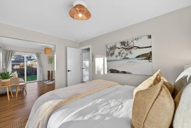 a bedroom with a bed and ceiling fan