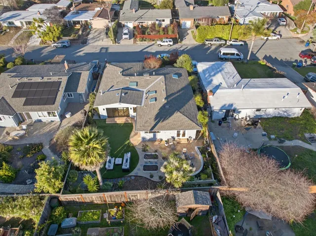 an aerial view of a houses with yard