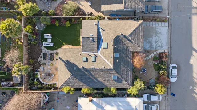 an aerial view of a house with a swimming pool