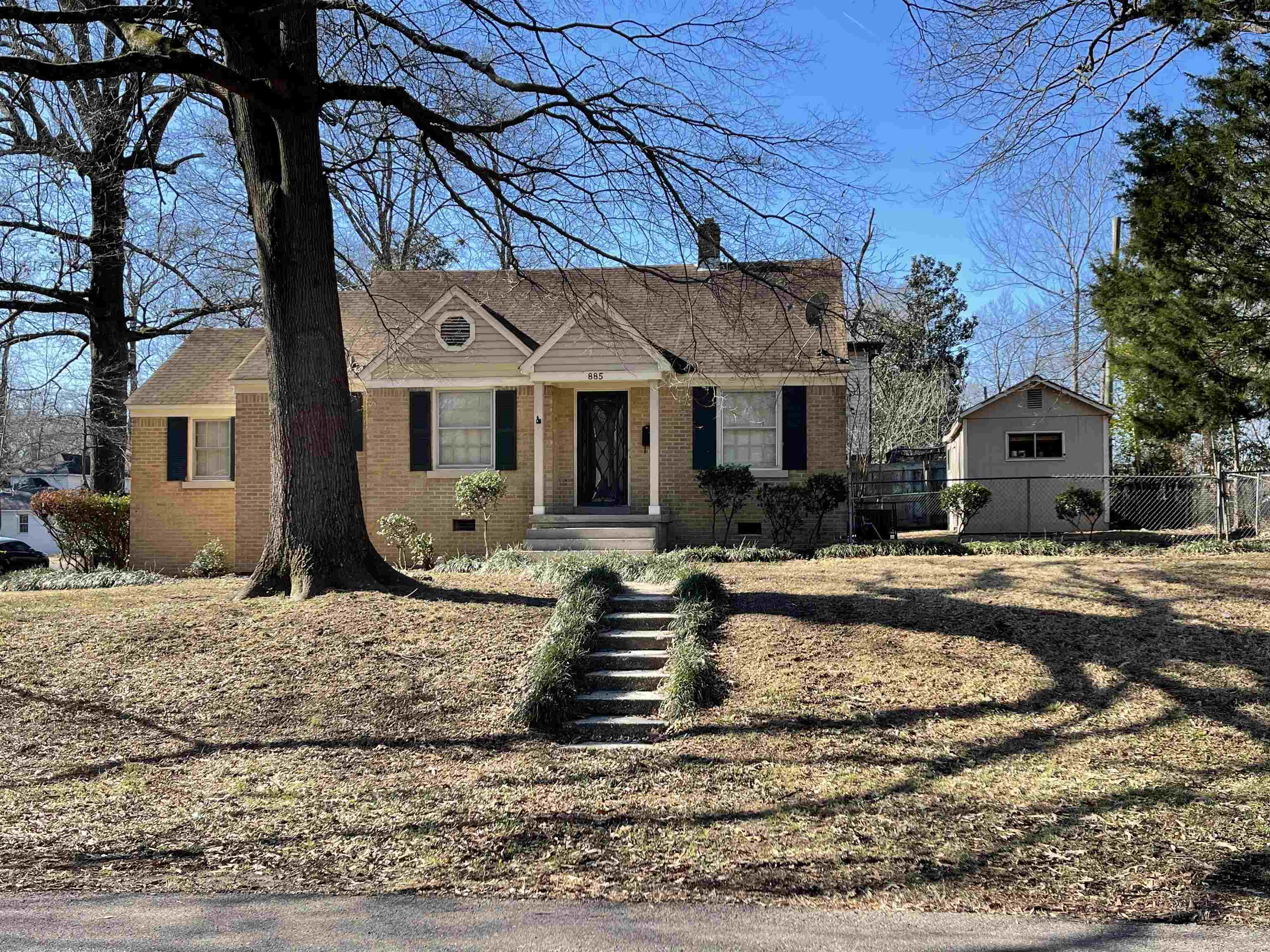 885 Echles Street Memphis, TN 38111 - Photo 15 of 18 a front view of a house with garden