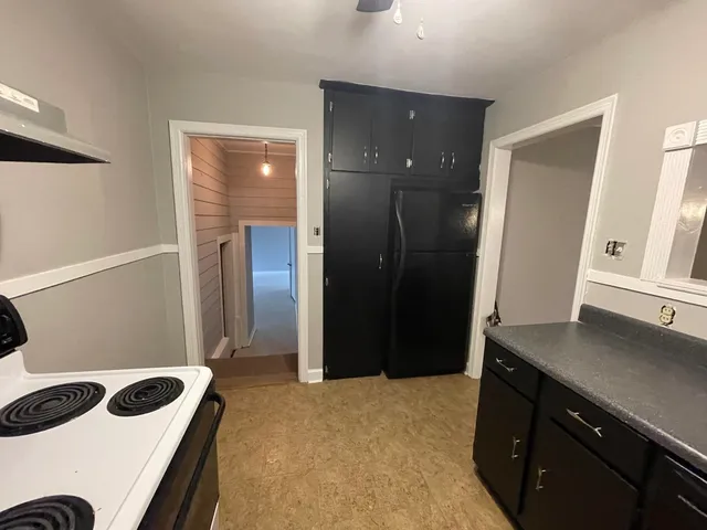 a bedroom with a bed and a sink