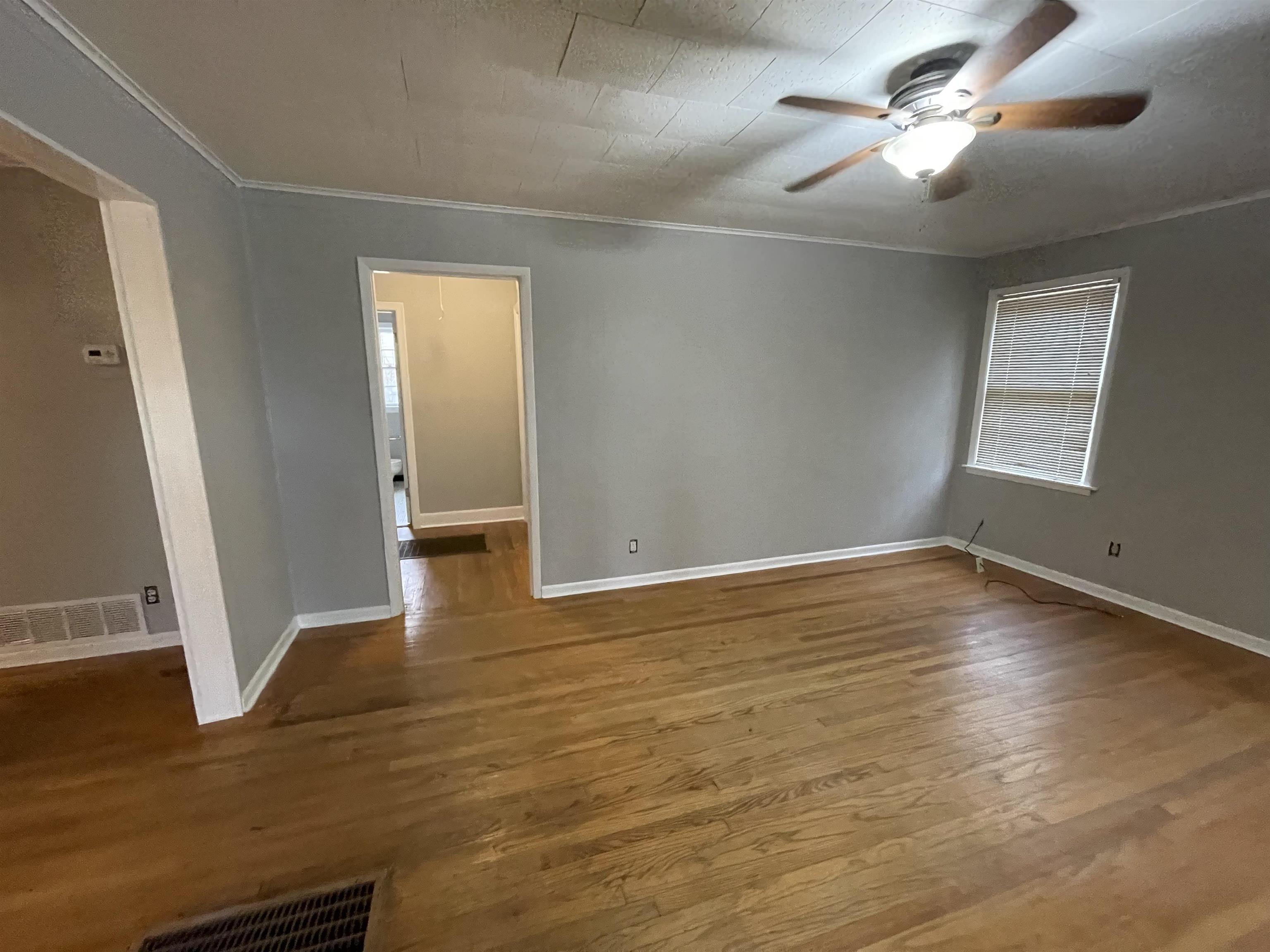 885 Echles Street Memphis, TN 38111 - Photo 6 of 18 a view of empty room with wooden floor