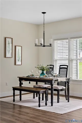 a workspace with furniture window and wooden floor