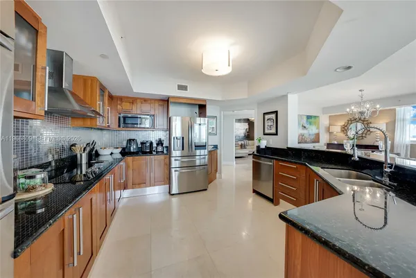 a kitchen with counter top space and stainless steel appliances
