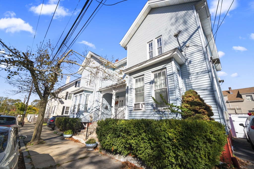 a view of a house with a backyard