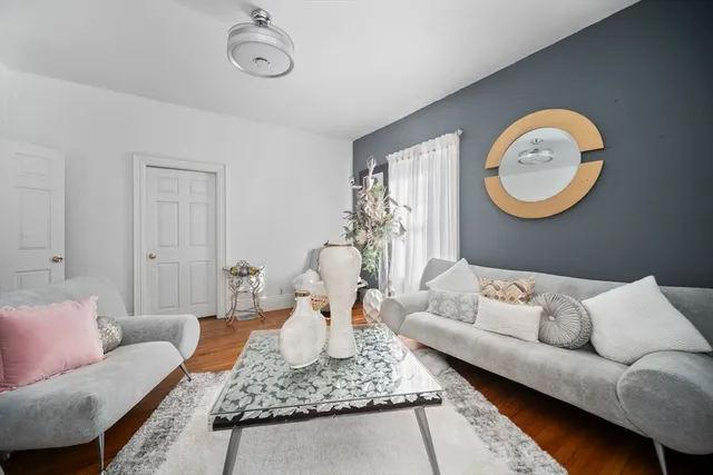 a living room with furniture and a rug