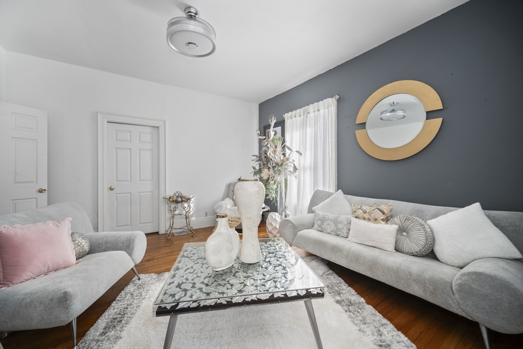 14-16 Dexter Street Lynn, MA 01902 - Photo 12 of 33 a living room with furniture and a rug