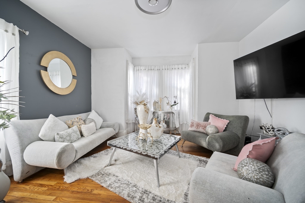 14-16 Dexter Street Lynn, MA 01902 - Photo 14 of 33 a living room with furniture and a flat screen tv