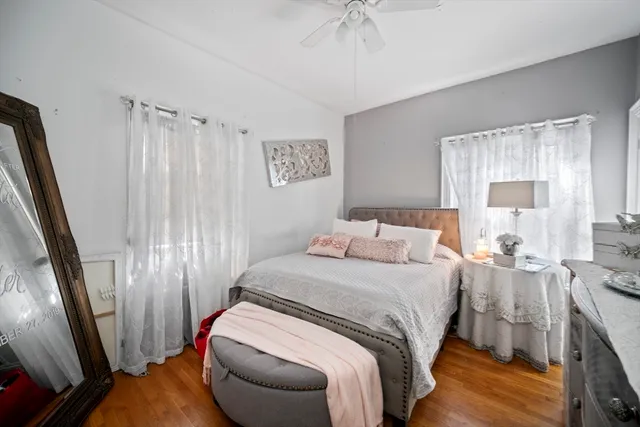 a bedroom with a bed and a mirror