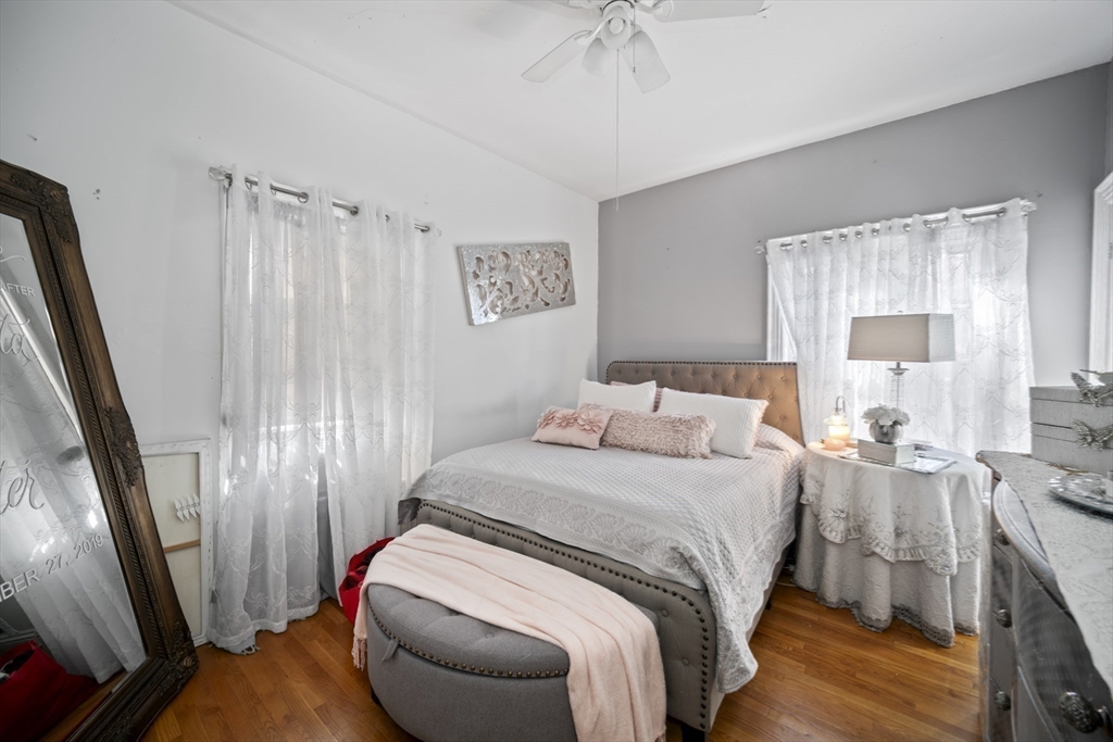 14-16 Dexter Street Lynn, MA 01902 - Photo 18 of 33 a bedroom with a bed and a mirror