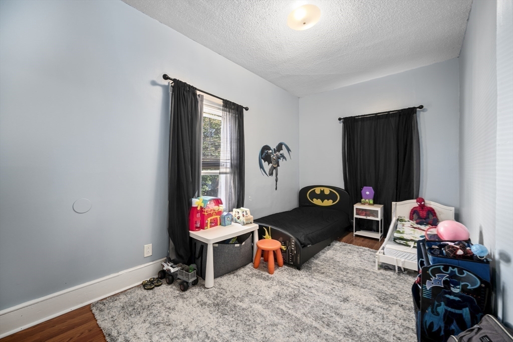 14-16 Dexter Street Lynn, MA 01902 - Photo 19 of 33 a living room with a couch and a table