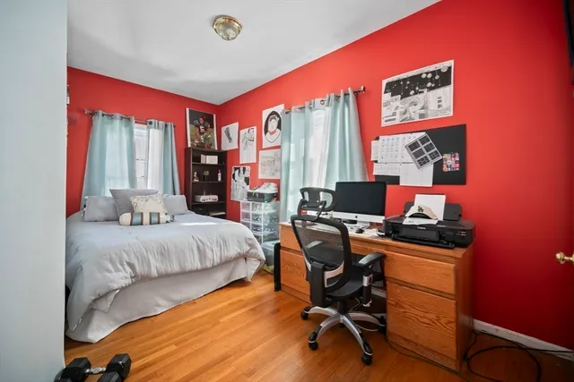 a bedroom with a workspace