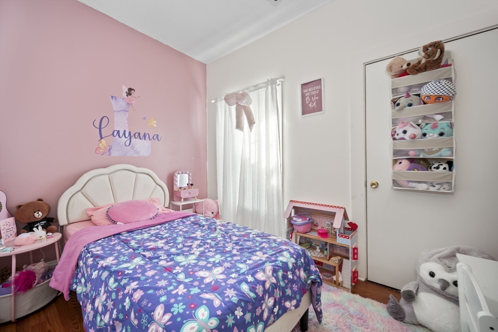 14-16 Dexter Street Lynn, MA 01902 - Photo 22 of 33 a bedroom with a bed and a dresser