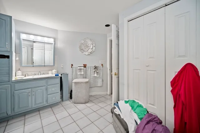 a room with a sink and a chair