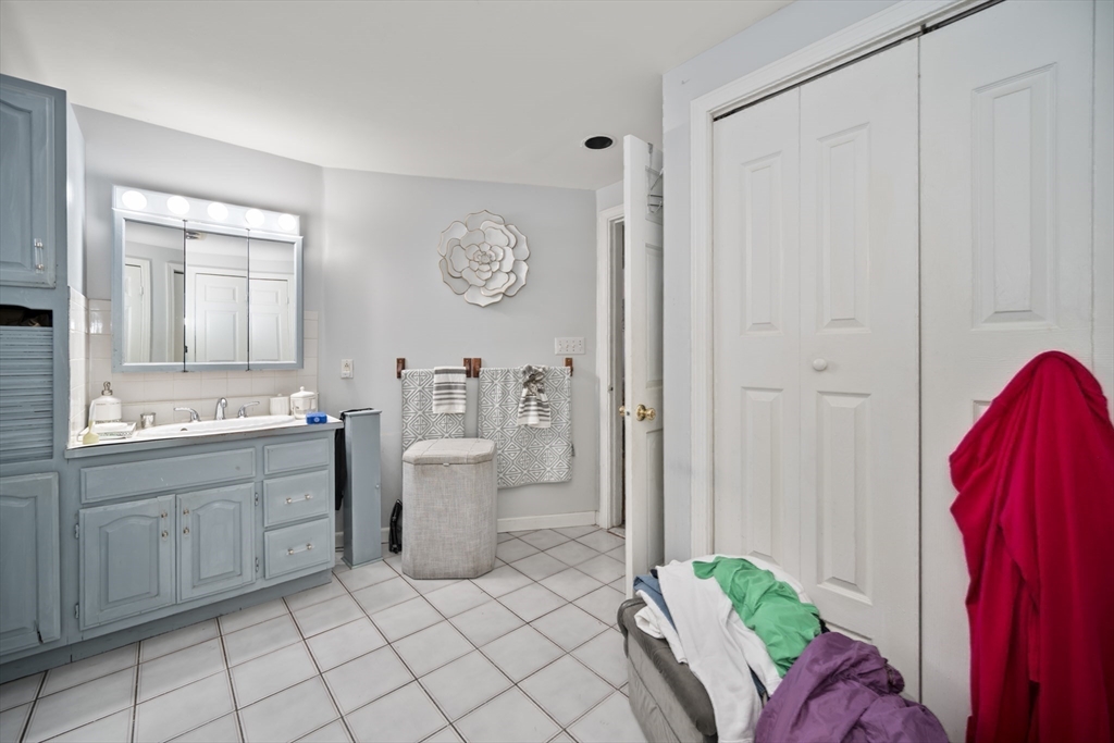 14-16 Dexter Street Lynn, MA 01902 - Photo 24 of 33 a room with a sink and a chair