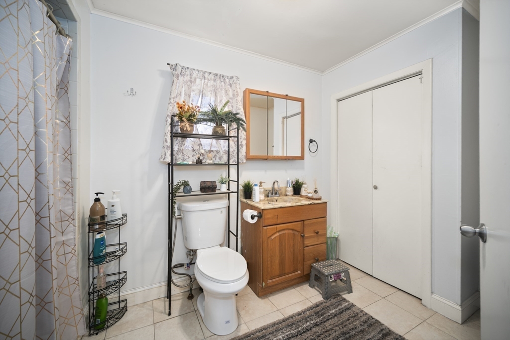 14-16 Dexter Street Lynn, MA 01902 - Photo 25 of 33 a bathroom with a toilet a sink and a shower