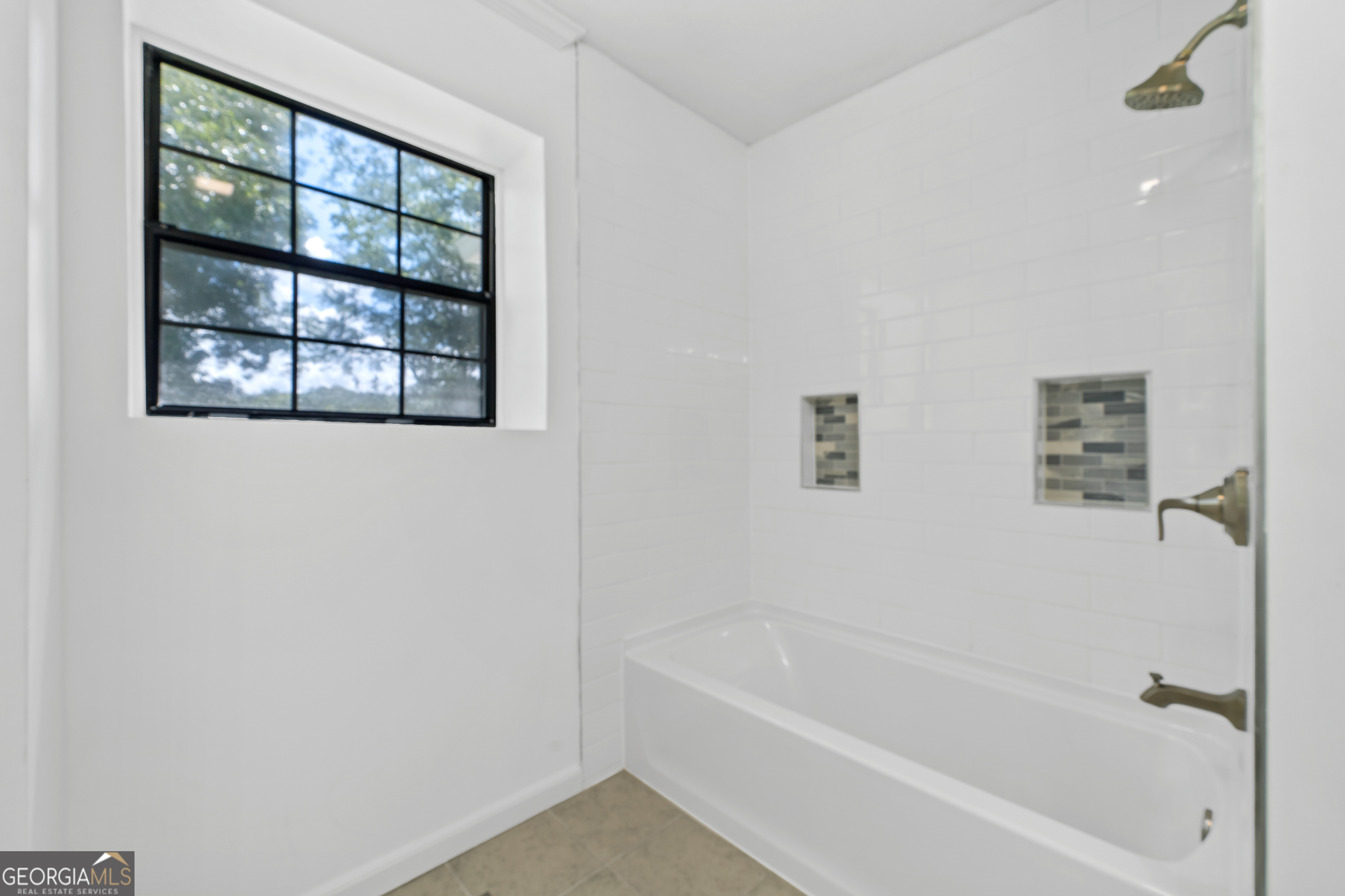 274 South Steel Bridge Road Eatonton, GA 31024 - Photo 14 of 39 a white bath tub sitting next to a window