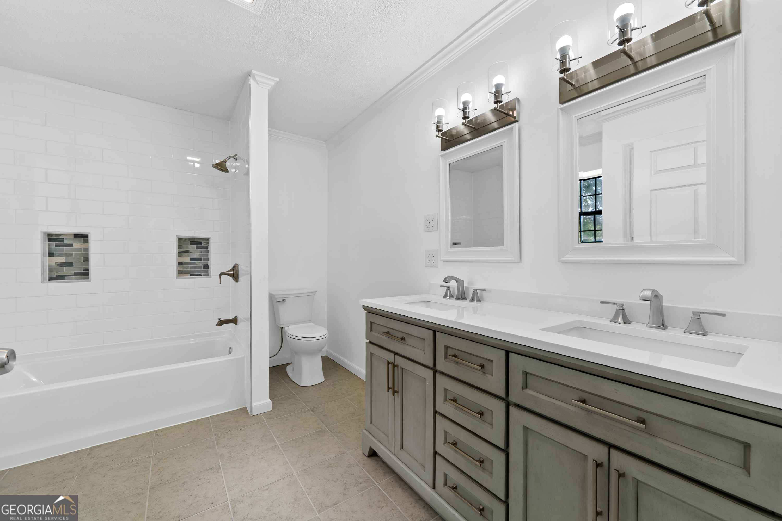 274 South Steel Bridge Road Eatonton, GA 31024 - Photo 15 of 39 a bathroom with a double vanity sink toilet and bathtub