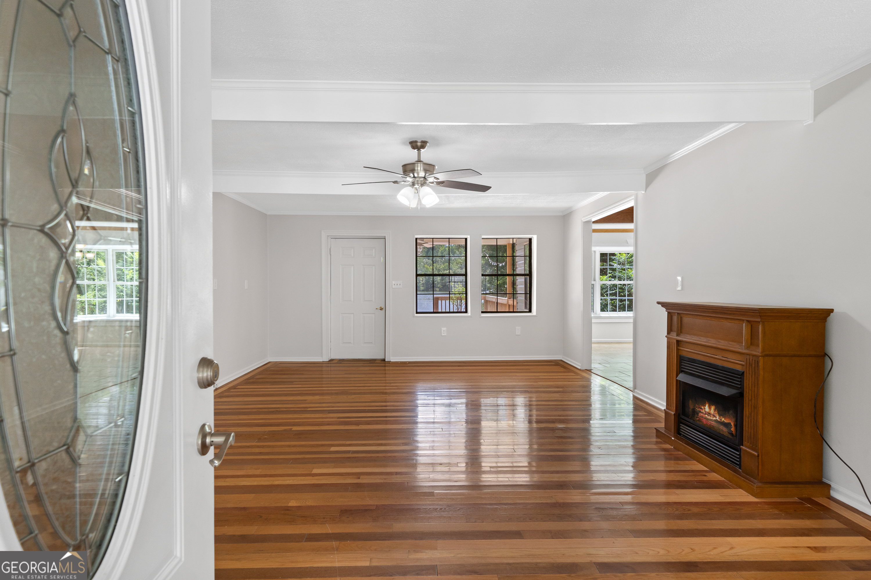 274 South Steel Bridge Road Eatonton, GA 31024 - Photo 2 of 39 a view of empty room with window and fireplace