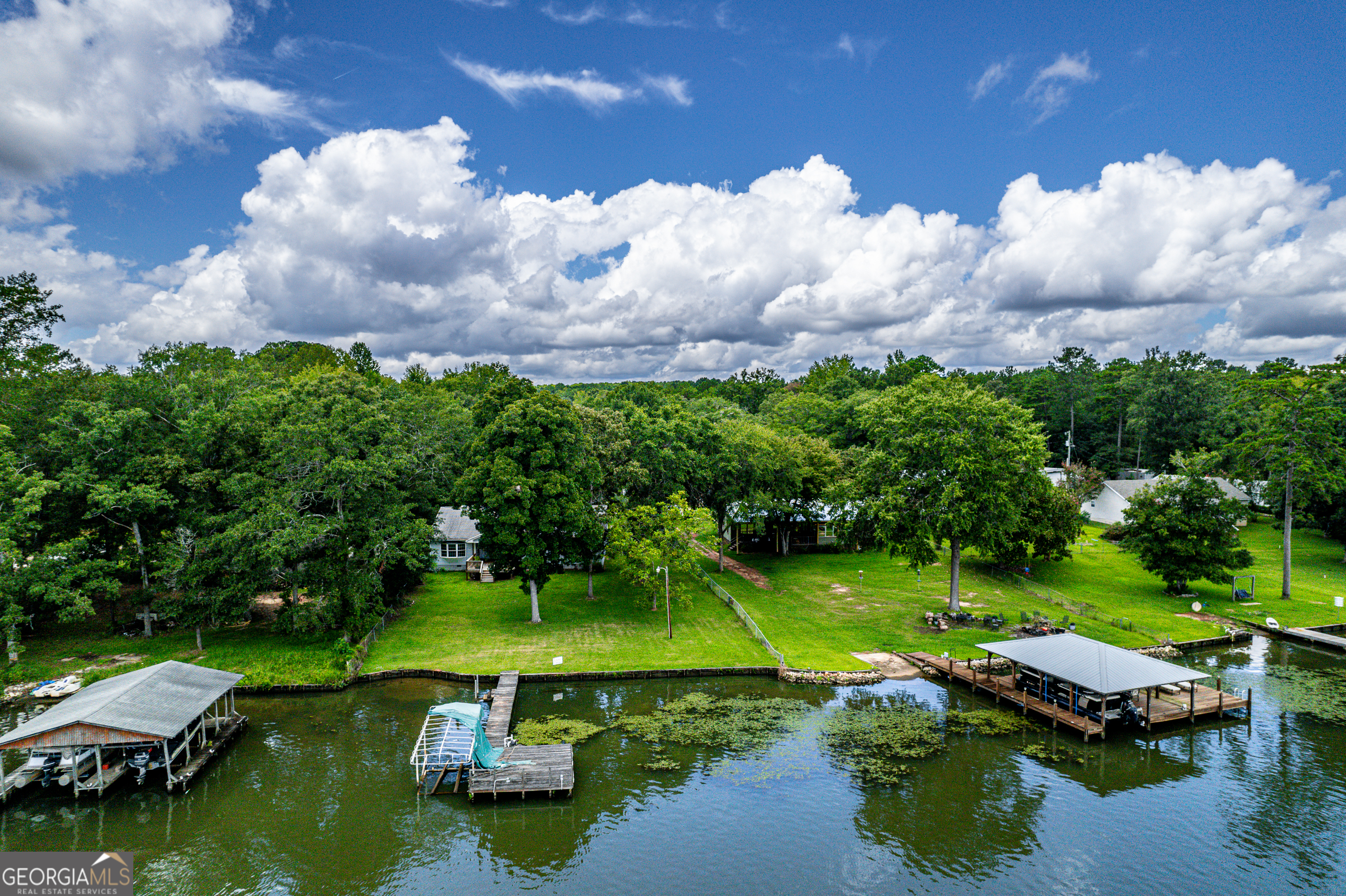 274 South Steel Bridge Road Eatonton, GA 31024 - Photo 23 of 39 aerial view of a house with backyard space and lake view