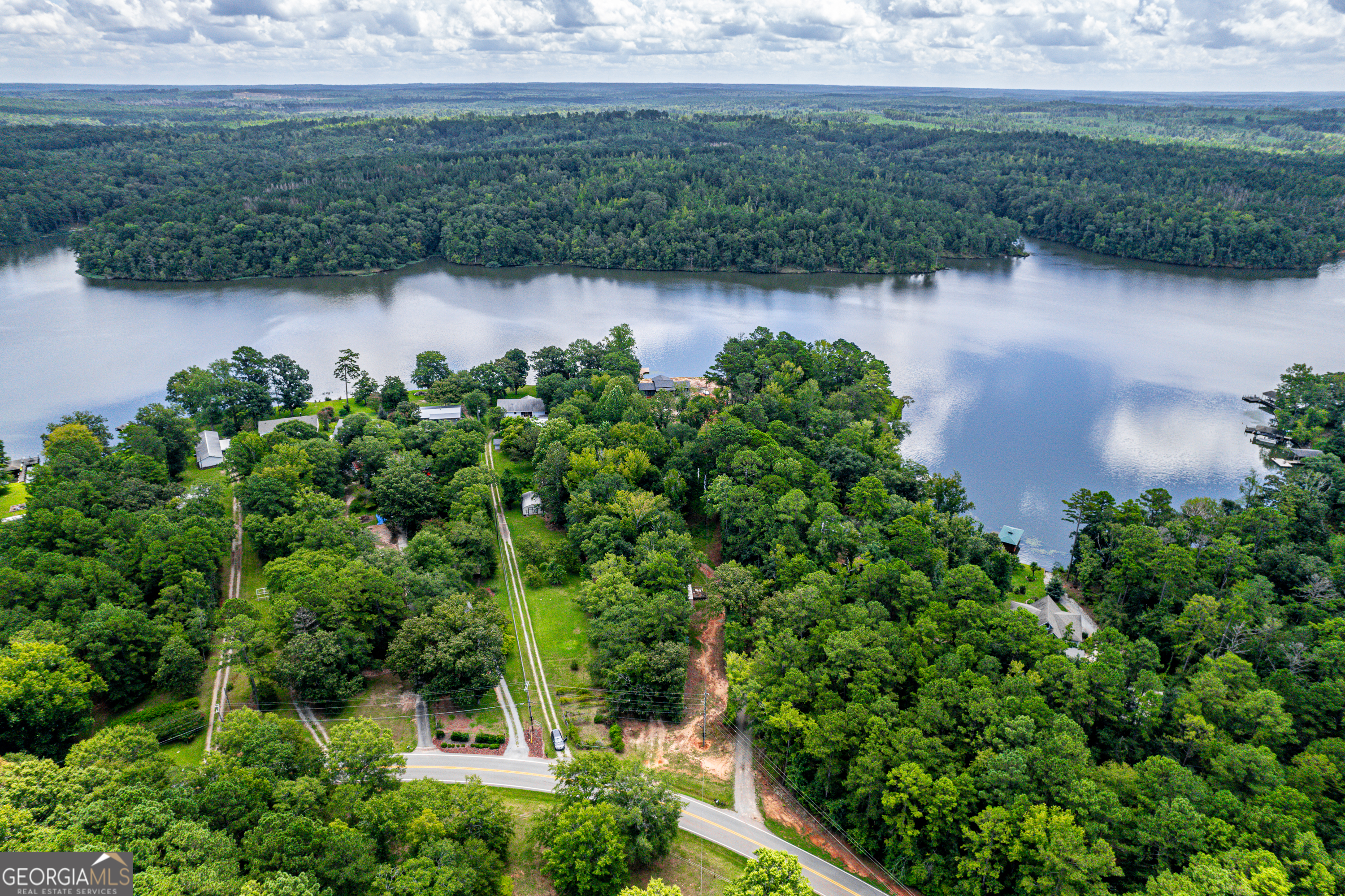 274 South Steel Bridge Road Eatonton, GA 31024 - Photo 24 of 39 an aerial view of a house with a yard and lake view