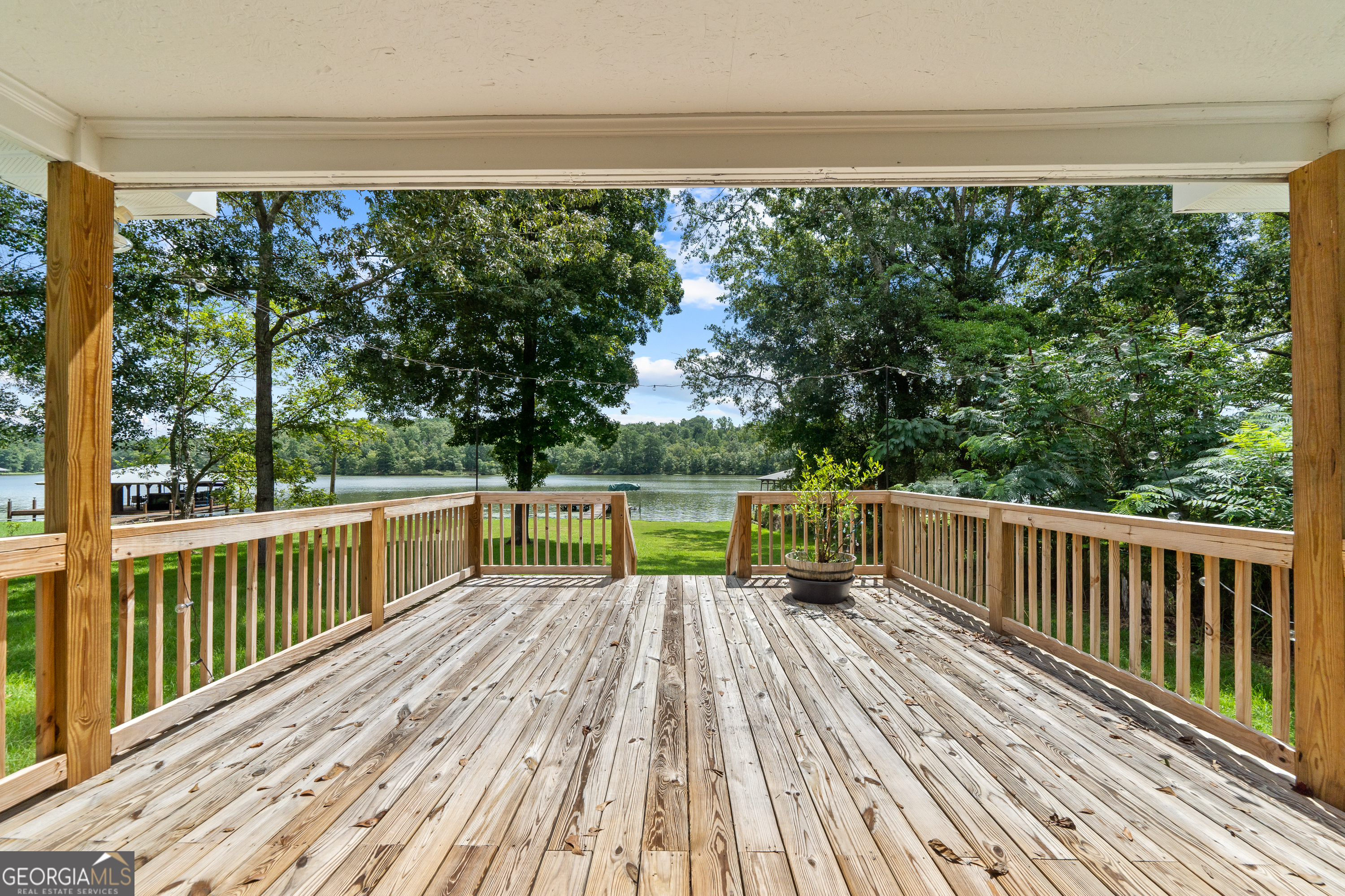 274 South Steel Bridge Road Eatonton, GA 31024 - Photo 26 of 39 a view of balcony with furniture and wooden floor