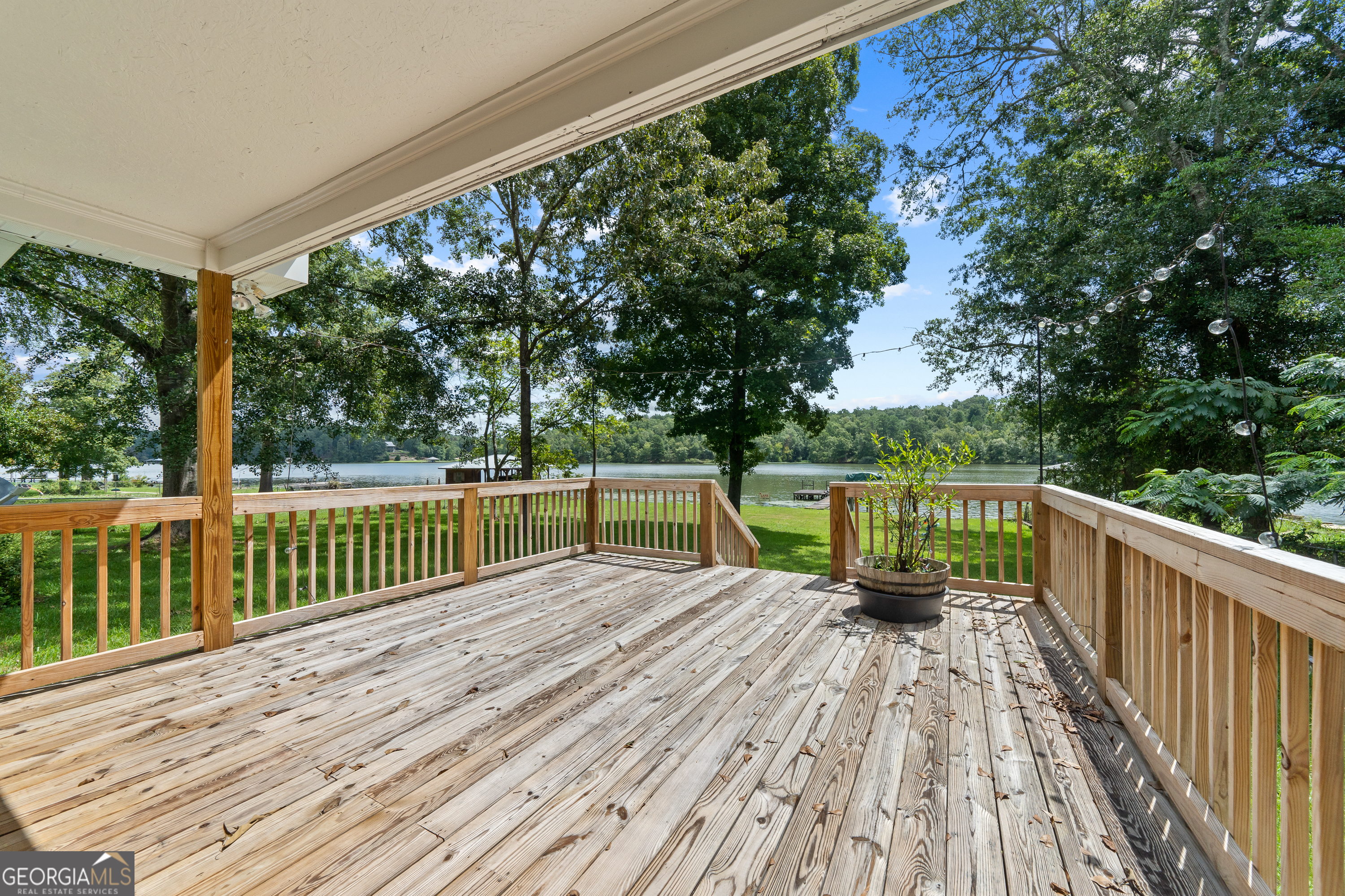 274 South Steel Bridge Road Eatonton, GA 31024 - Photo 27 of 39 a view of balcony with deck and wooden floor