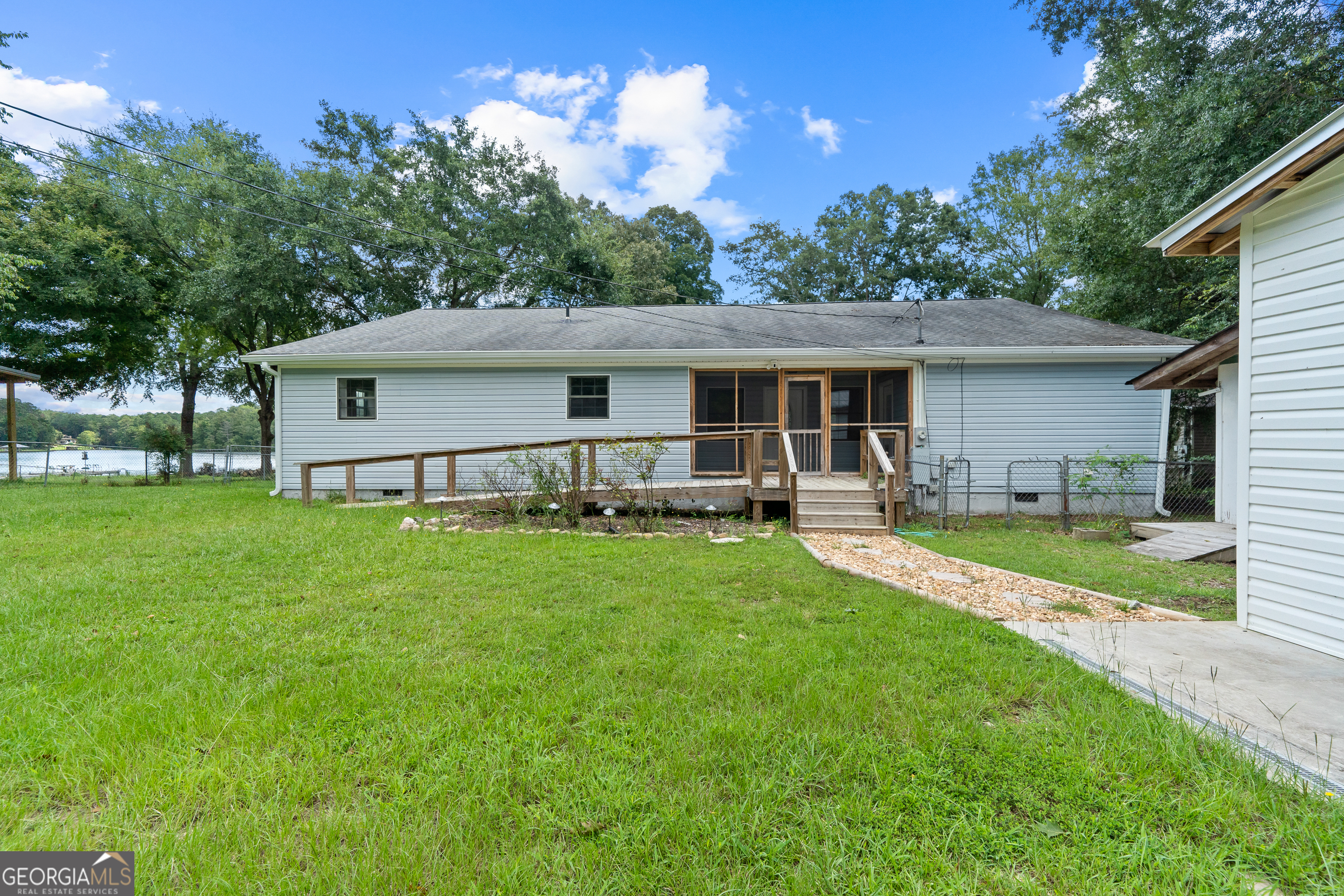 274 South Steel Bridge Road Eatonton, GA 31024 - Photo 35 of 39 a front view of house with yard and green space