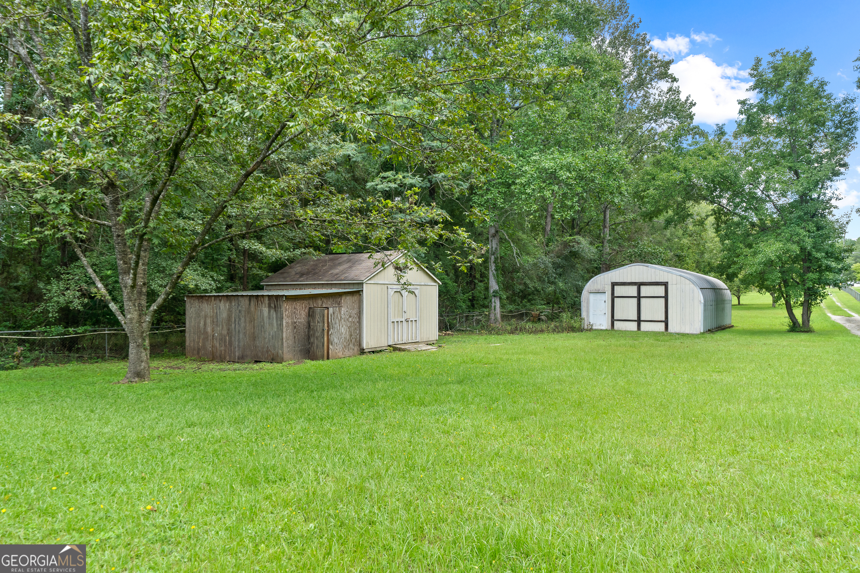 274 South Steel Bridge Road Eatonton, GA 31024 - Photo 38 of 39 a view of a back yard of the house