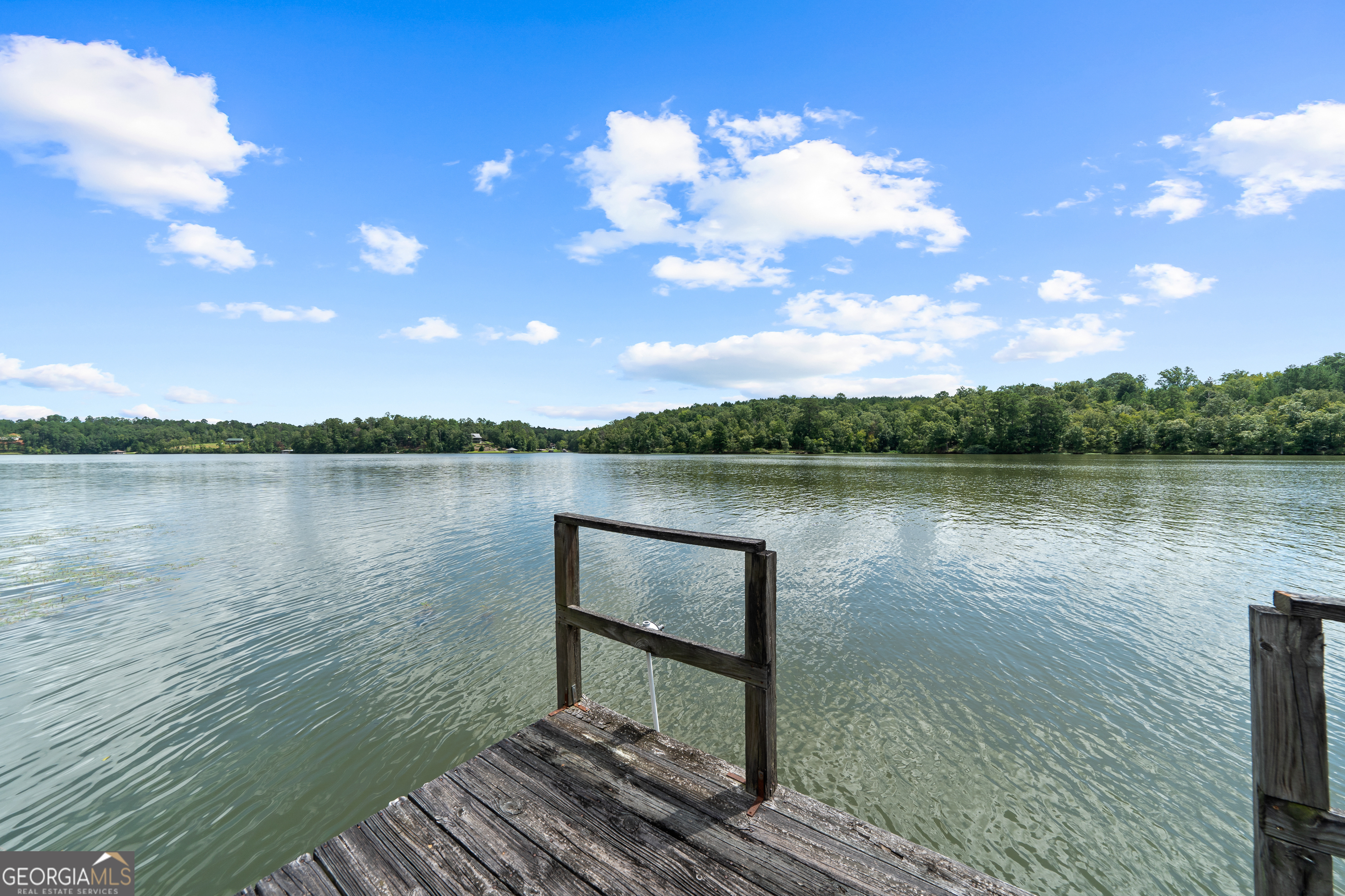 274 South Steel Bridge Road Eatonton, GA 31024 - Photo 39 of 39 a view of a lake with houses in the back
