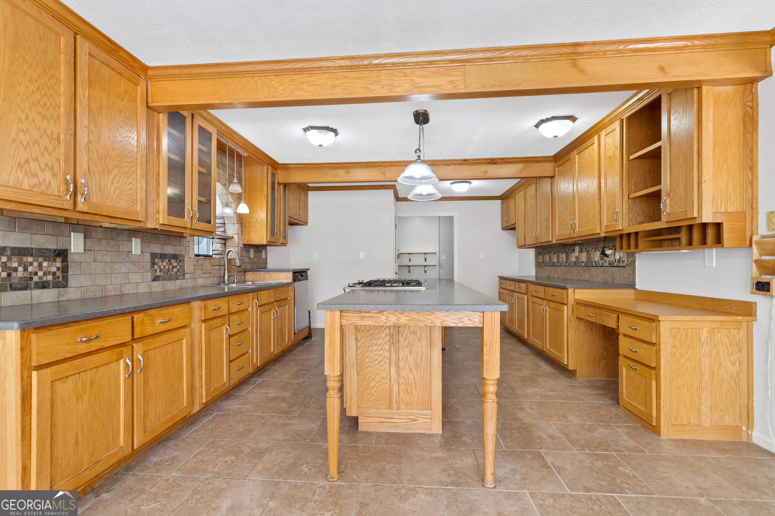 274 South Steel Bridge Road Eatonton, GA 31024 - Photo 7 of 39 a kitchen with stainless steel appliances granite countertop a sink and cabinets