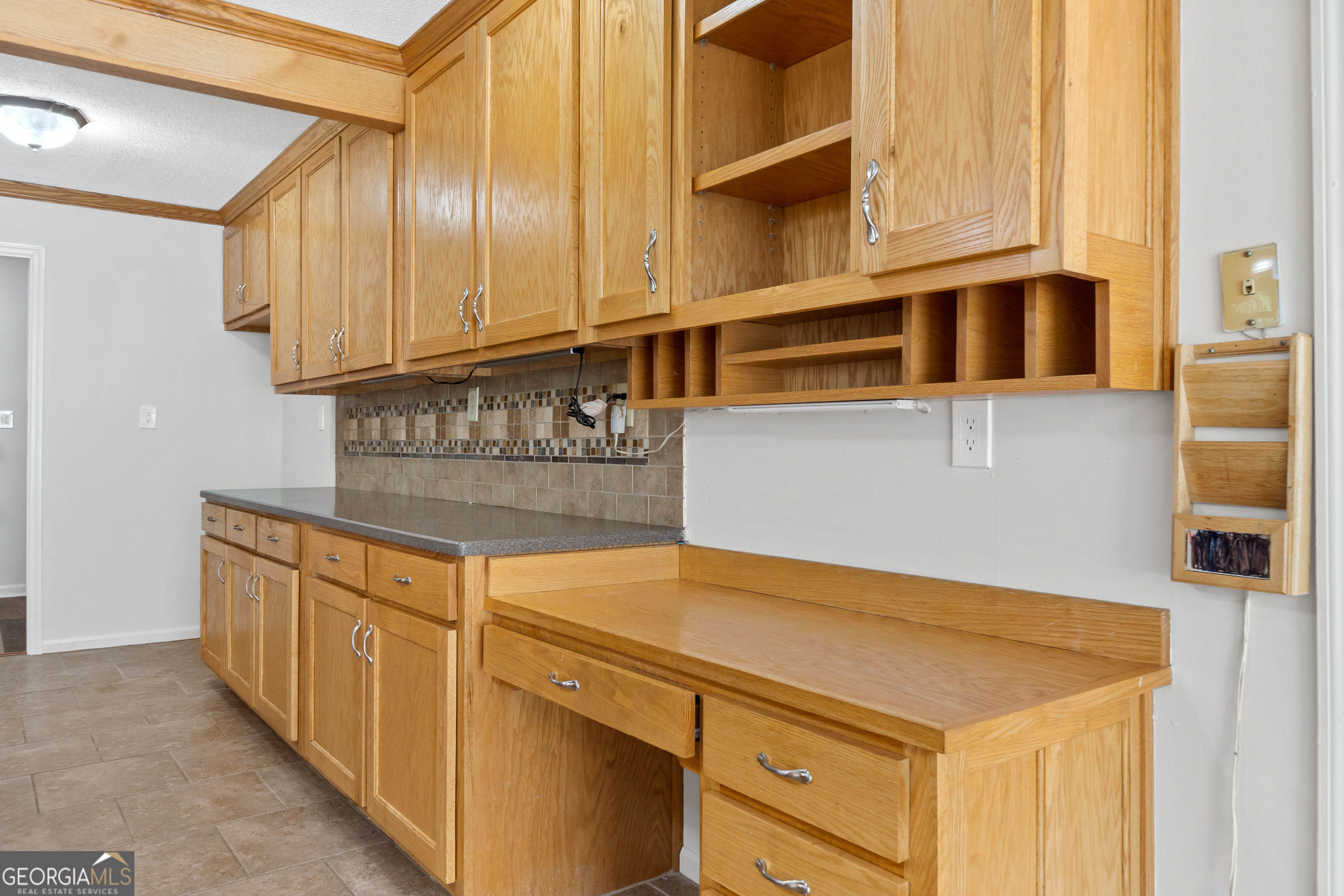 274 South Steel Bridge Road Eatonton, GA 31024 - Photo 8 of 39 a kitchen with stainless steel appliances a cabinets and a counter top space