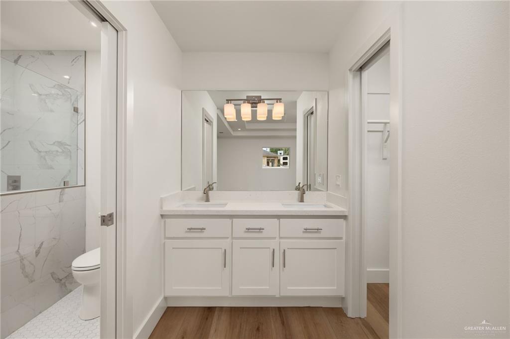 34732 Kretz Road, Unit 2 Los Fresnos, TX 78566 - Photo 10 of 22 a bathroom with a sink a toilet and shower