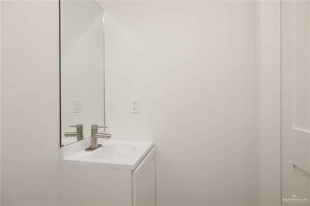 34732 Kretz Road, Unit 2 Los Fresnos, TX 78566 - Photo 14 of 22 a bathroom with a sink and a mirror