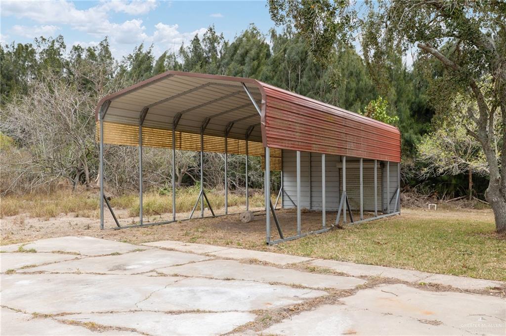 34732 Kretz Road, Unit 2 Los Fresnos, TX 78566 - Photo 18 of 22 a backyard of a house with table and chairs