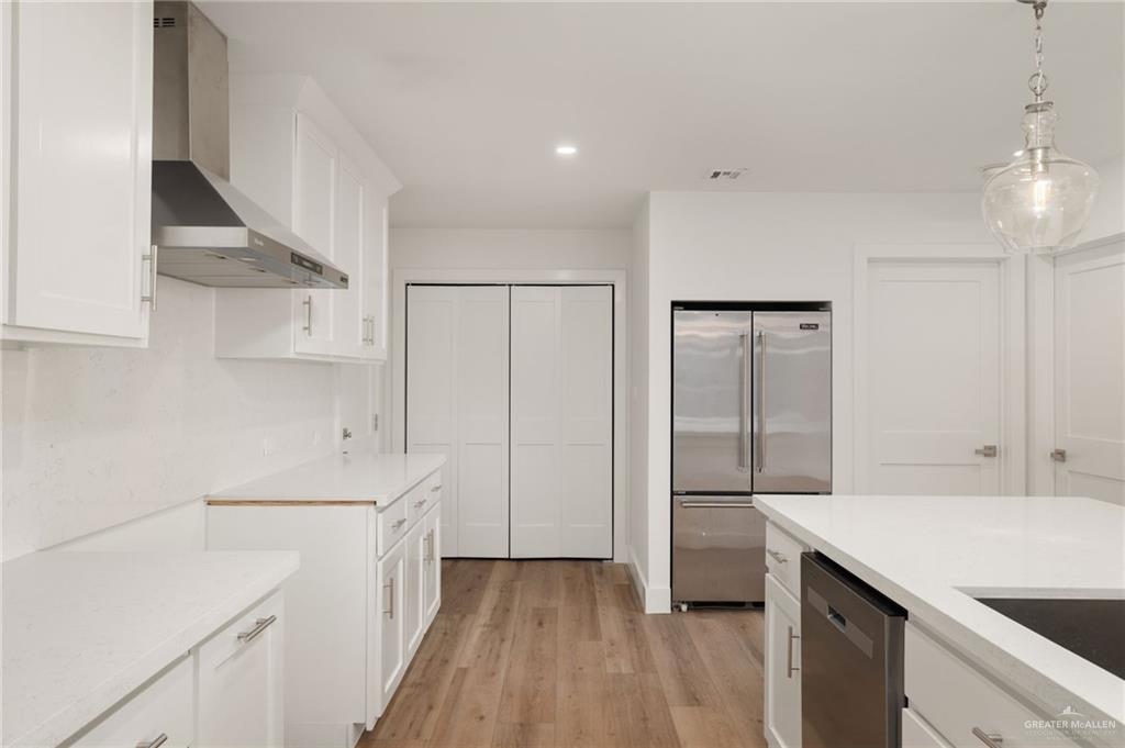 34732 Kretz Road, Unit 2 Los Fresnos, TX 78566 - Photo 8 of 22 a kitchen with a sink appliances and cabinets