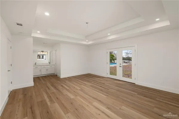 a kitchen with a sink appliances and cabinets