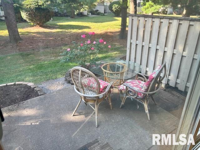 3550 Devils Glen Road Bettendorf, IA 52722 - Photo 12 of 30 a view of a chairs and fire pit in the backyard