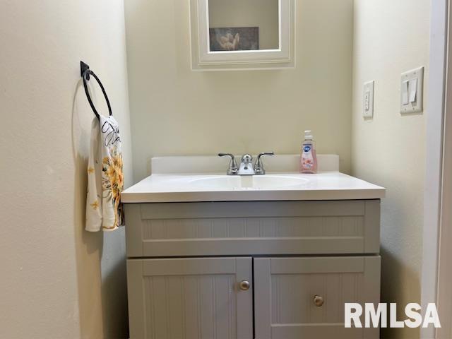 3550 Devils Glen Road Bettendorf, IA 52722 - Photo 15 of 30 a bathroom with a sink and a mirror